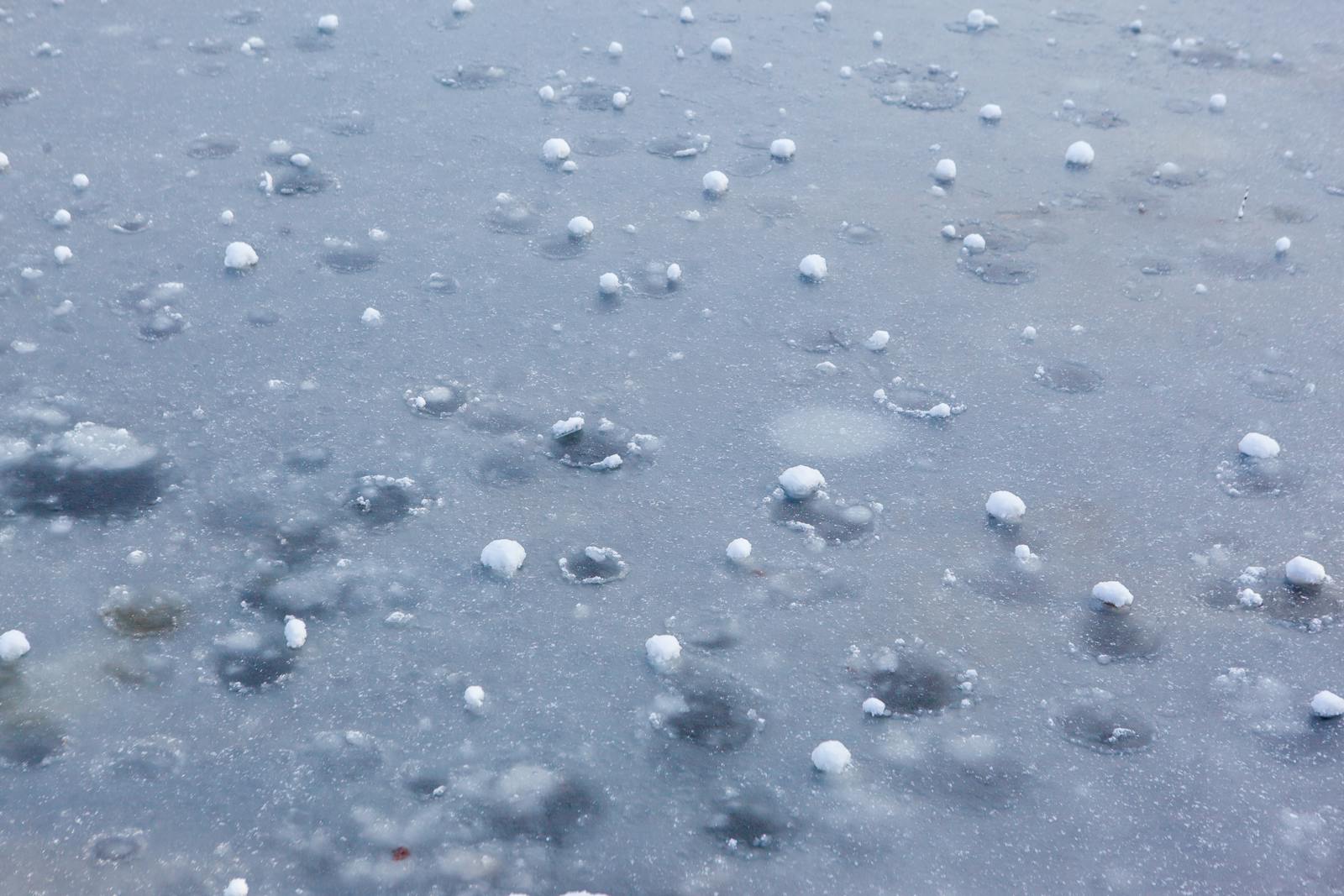 Hailstones on frozen ground, illustrating hail frequency in Germany and ESRS E1-9