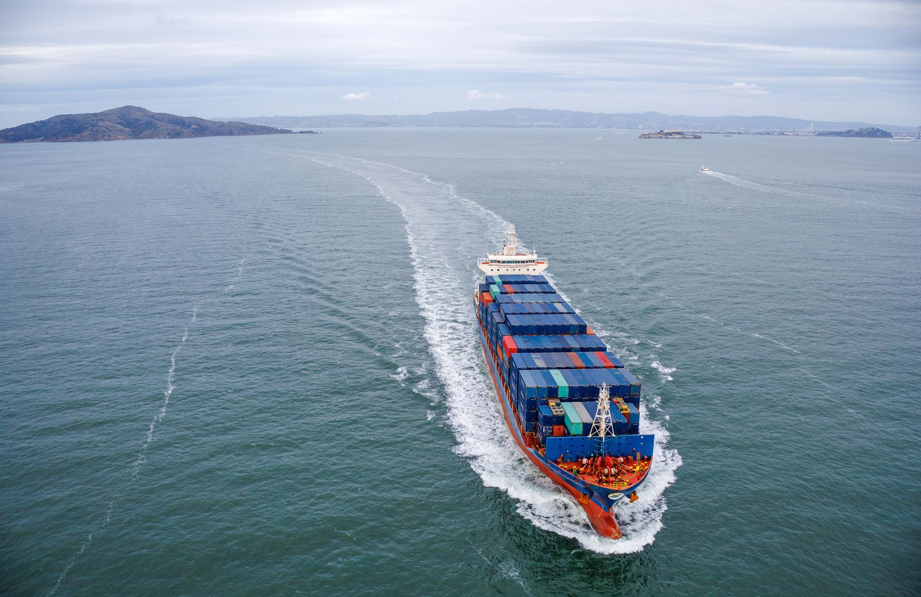 Aerial view of a container ship sailing on open water
