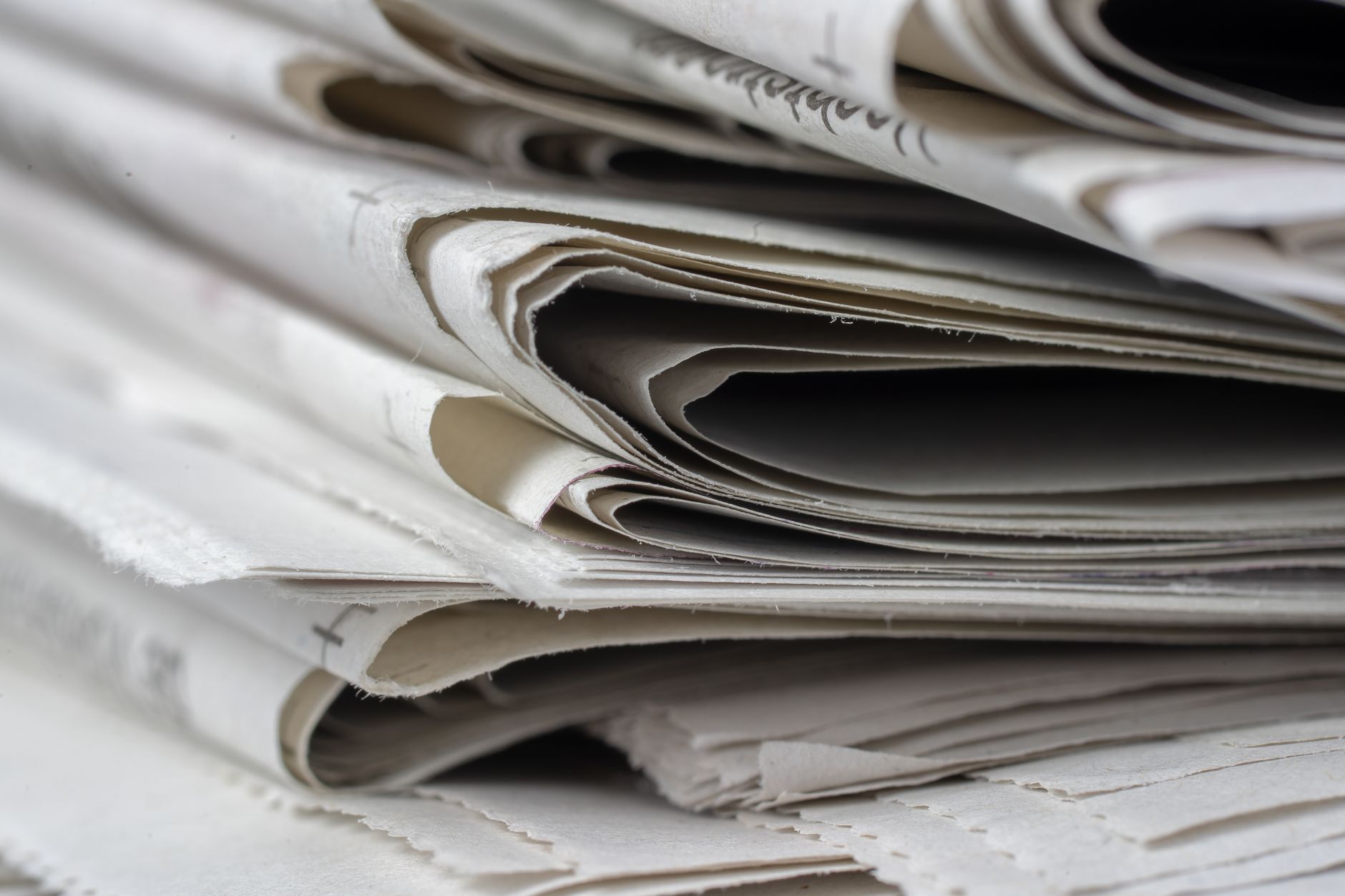 Close-up of a stack of folded newspapers